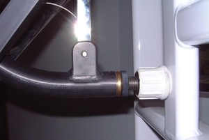 A close-up detail of the in-field adjustable leveling standoff. Our design protects the crutchtip from damage and requires no tools for fine adjustment.
